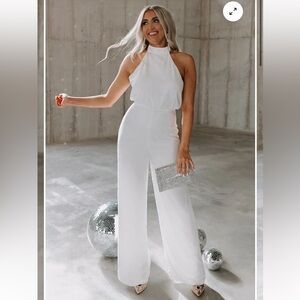 Brand new with tags and in plastic white jumpsuit